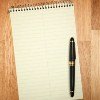 A notepad and a pen.
